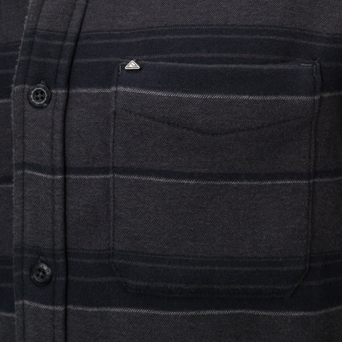 Close-up of the chest pocket on the Bartlett Woven Jacket, featuring soft, durable, beach-inspired apparel fabric.