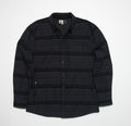 Front view of the Bartlett Woven Jacket in black with subtle stripes, featuring a button-up design and collar.