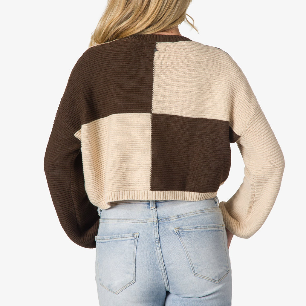 Back view of Carrie Sweater in brown and beige blocks, showing textured knit and relaxed fit for beach-inspired comfort.