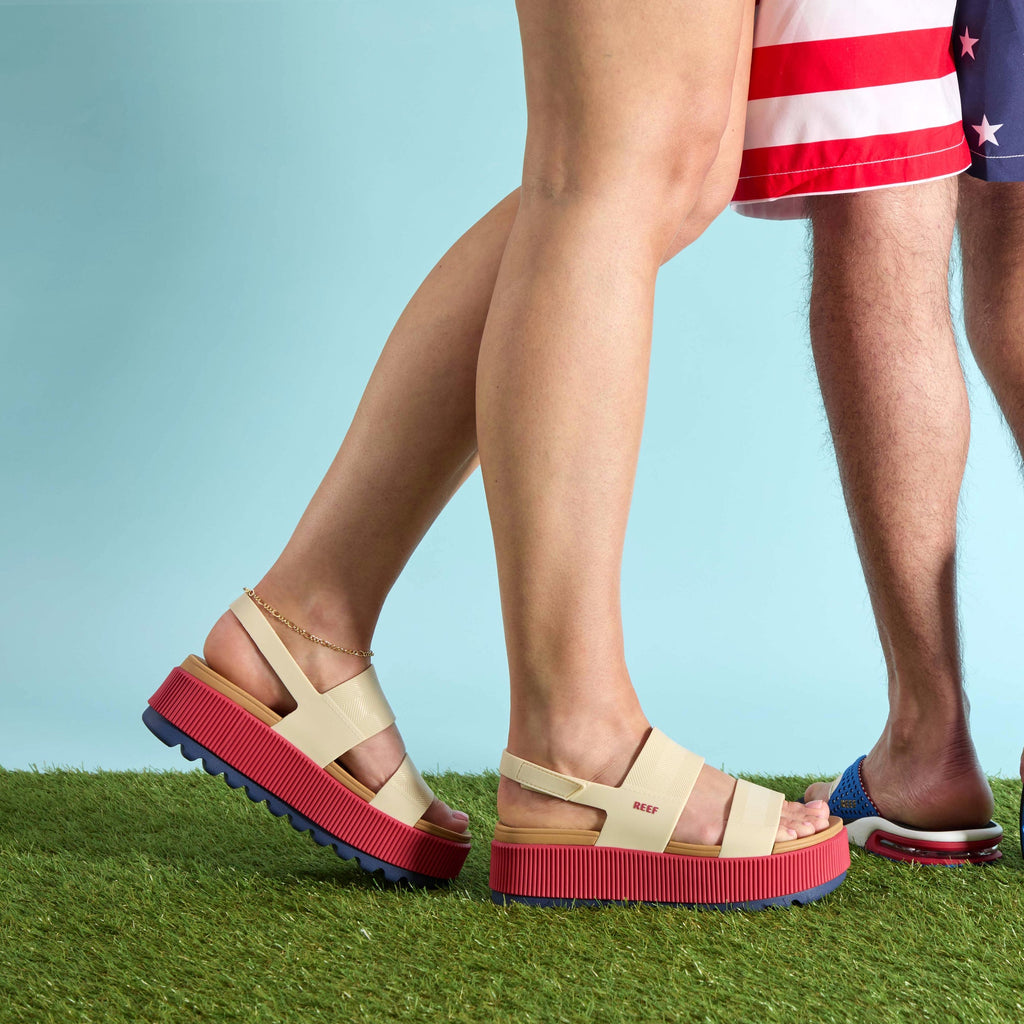 Side view of women's Water Vista Higher sandal with red platform sole, showcasing comfort and surf-inspired design.