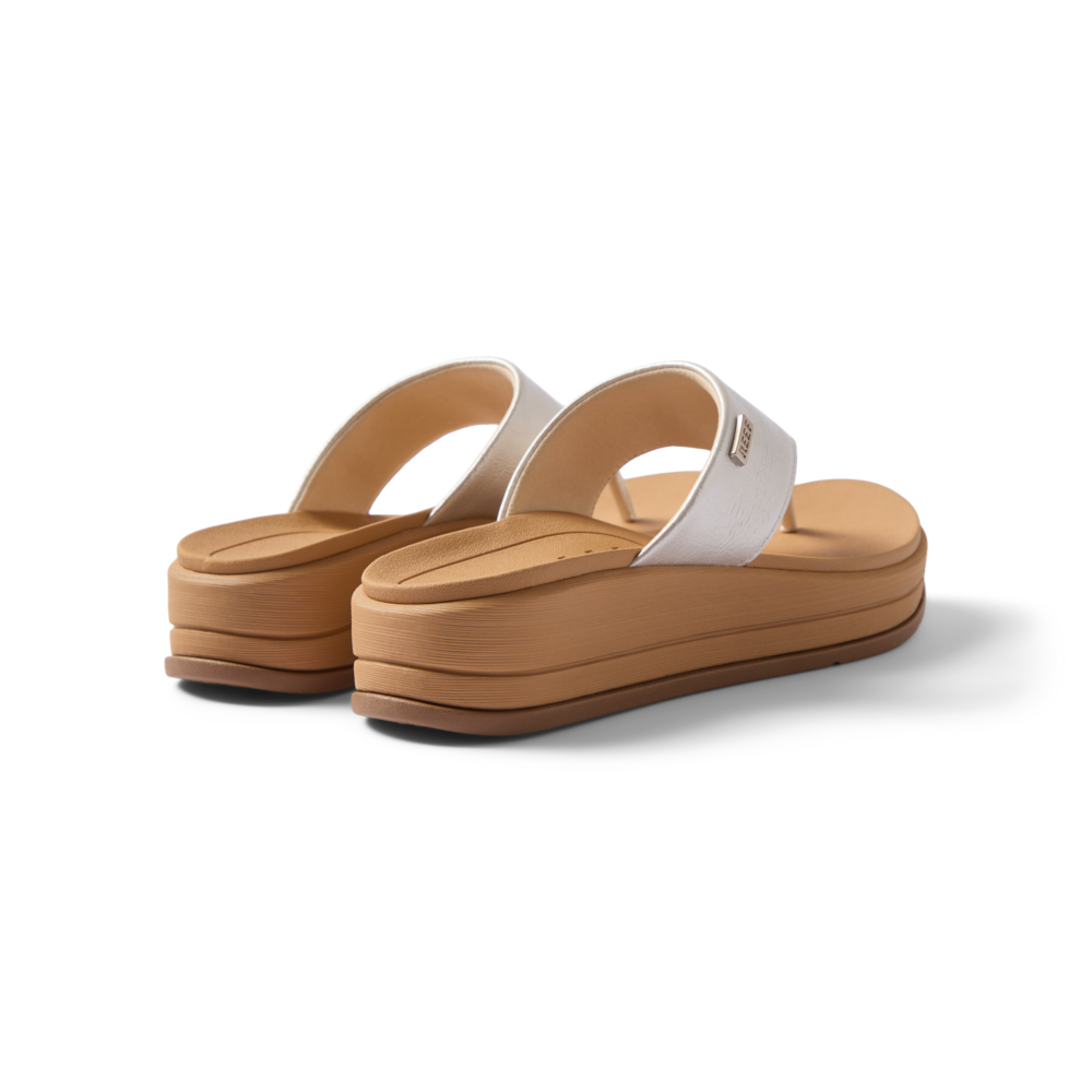 Aura Serenity women's sandals facing away, showing cushioned heels and arch support in beige and silver tones.