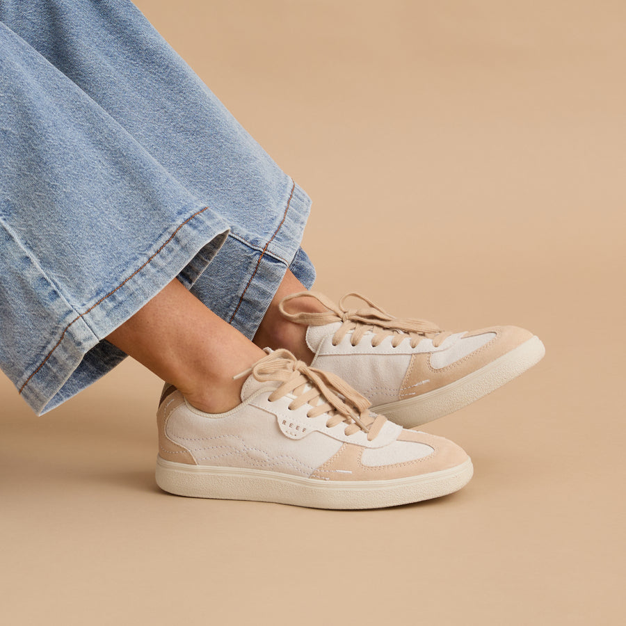 Side view of Boardwalk Callie women's sneakers in neutral tones with soft cushioning, perfect for beach-inspired comfort.