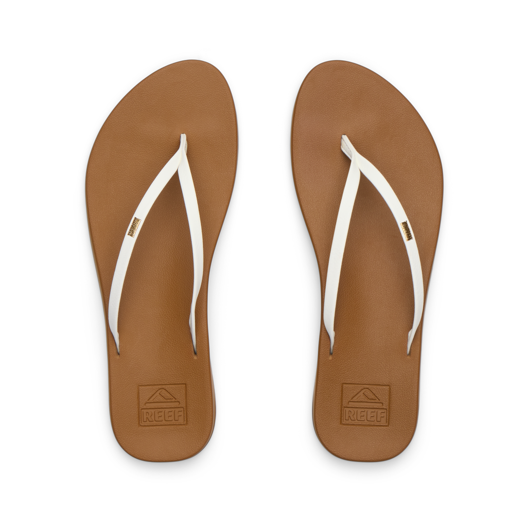 Top view of women's Cushion Slim flip flops in tan footbed with white straps, lightweight, water-friendly beach sandals.