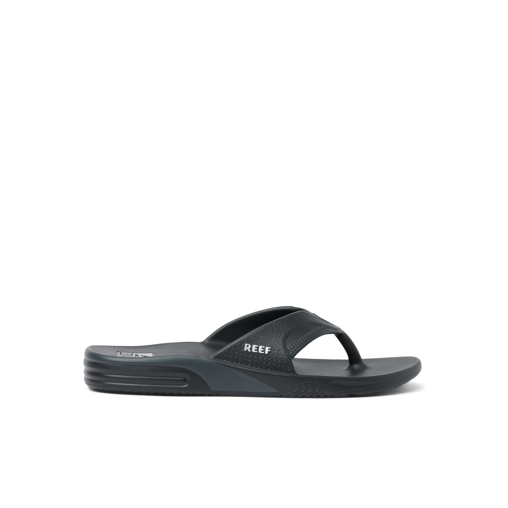 Fanning H2O men's black slide sandal facing right, featuring soft-rebound cushioning and anatomical arch support for beach comfort.