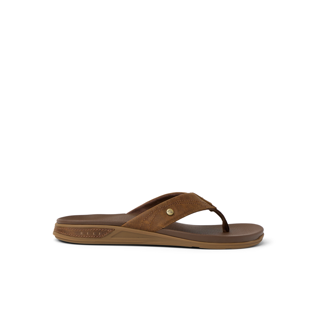 Phantom Lux men's brown flip flop sandal facing right, featuring comfort cushioning and anatomical arch support for beach use.