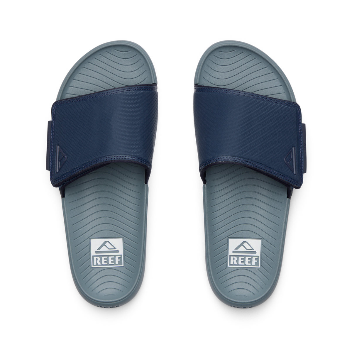Top-down view of Phantom Slab men's slides in navy and grey, featuring comfort cushioning and anatomical arch support.