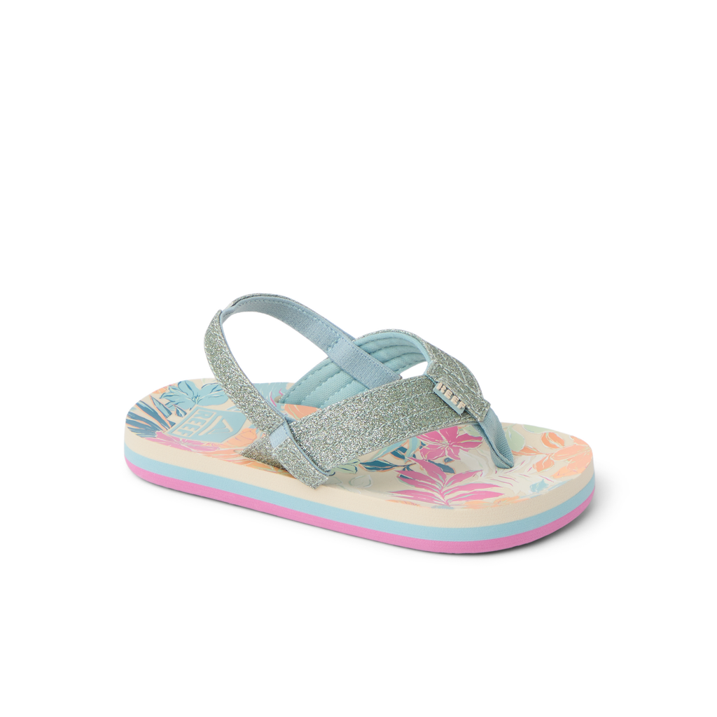 Little Ahi girls' sandal facing left, showing tropical floral footbed and glittery straps with arch support.