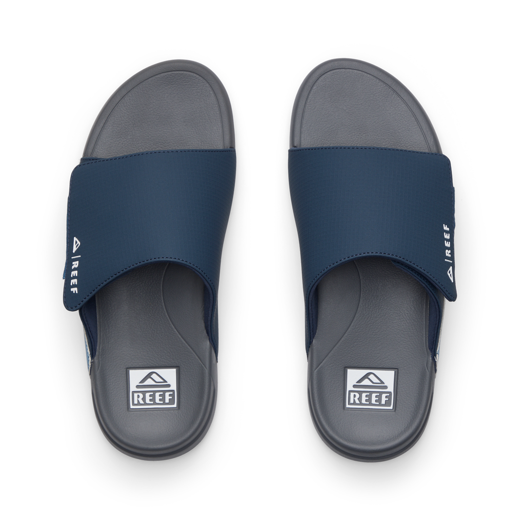 Top view of men's Cruiser Slide navy and grey slides with anatomical arch support and soft cushioning by REEF.