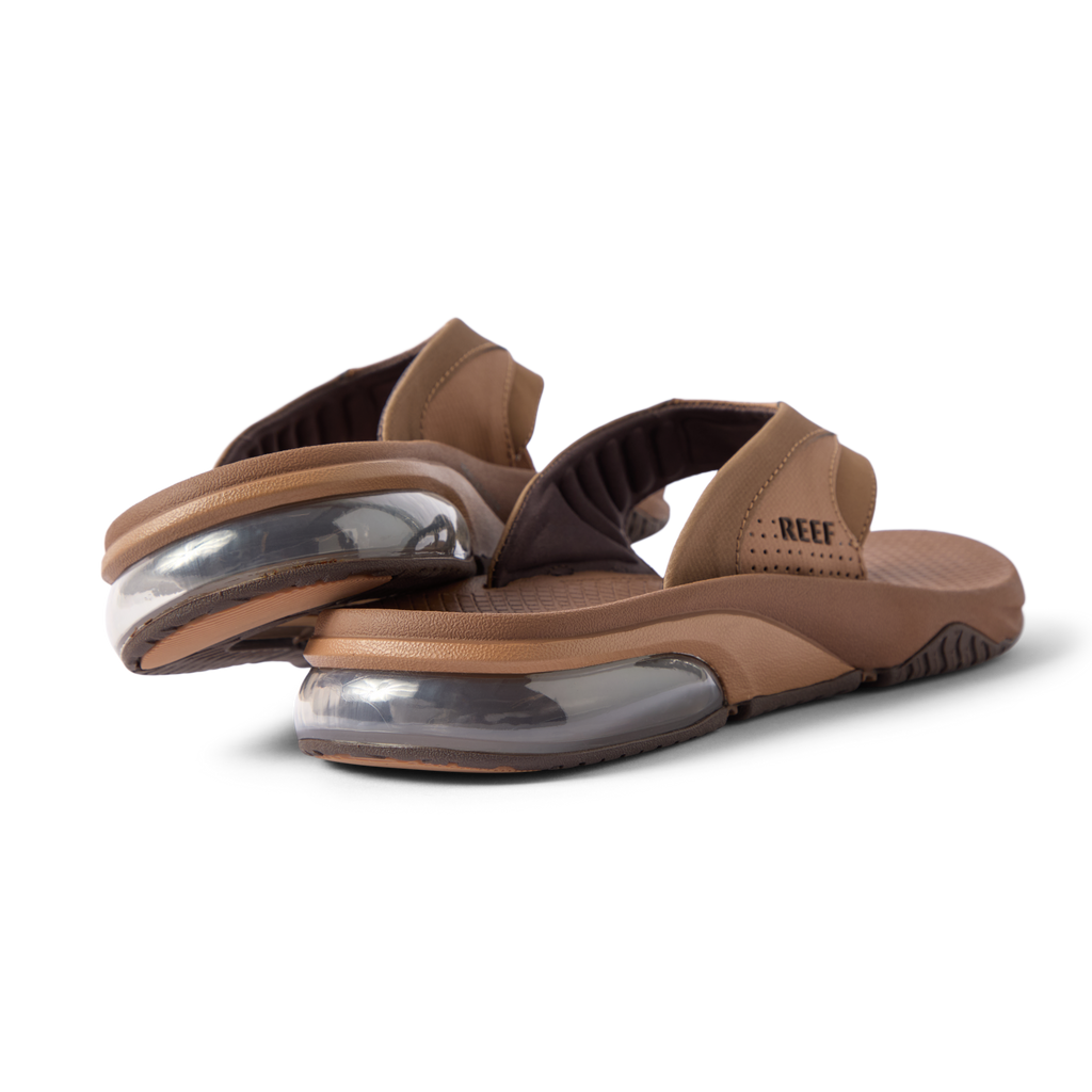 Rear close-up of brown Fanning + men's sandals showing soft-rebound cushioning and anatomical arch support, facing right.