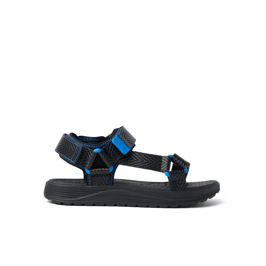 Kids Shoremazing sandal for boys facing right, black and blue with anatomical arch support and water-friendly materials.