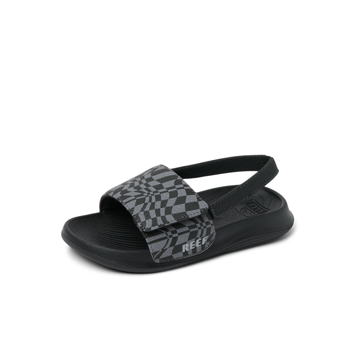 Little Salty Slide sandal for boys facing right, close-up on cushioned sole and checkered strap with arch support.