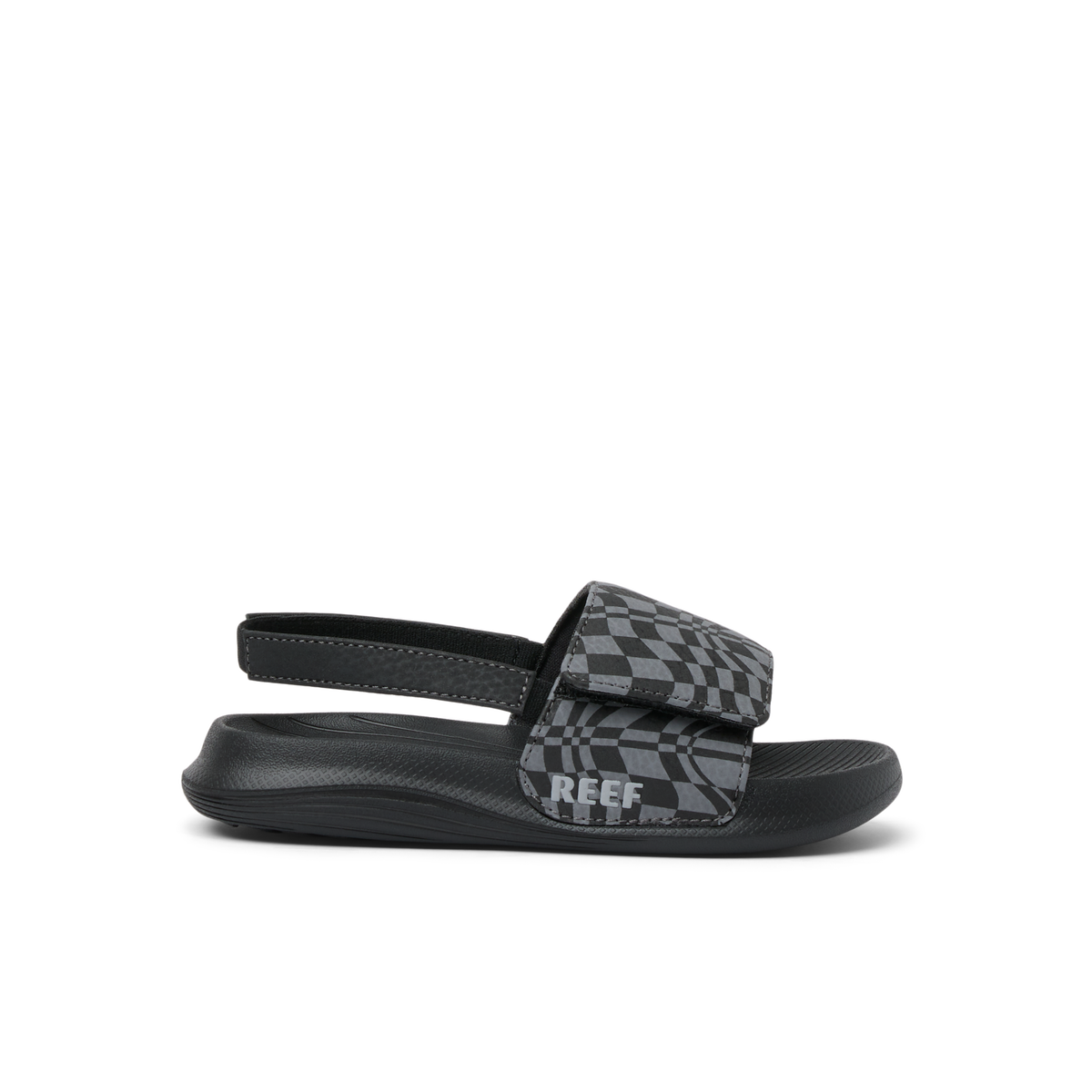 Little Salty Slide sandal for boys facing left, showing soft-rebound cushioning and checker pattern strap.