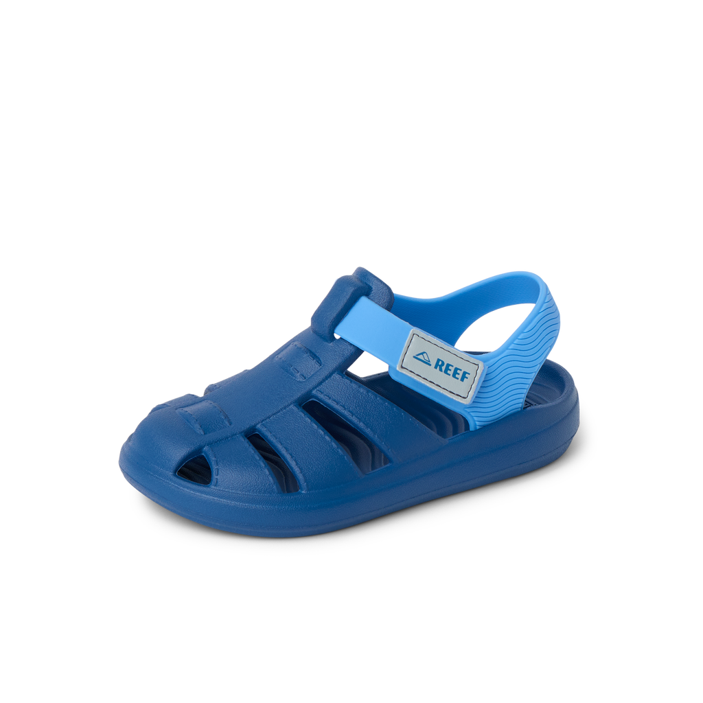 Little Totally Beachin sandal for boys facing left, close-up on blue water-friendly shoe with arch support and cushioning.