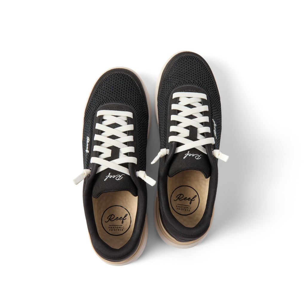 Top view of black Shoreline Palisades sneakers for women with white laces, breathable mesh, and cushioned insoles facing upward.