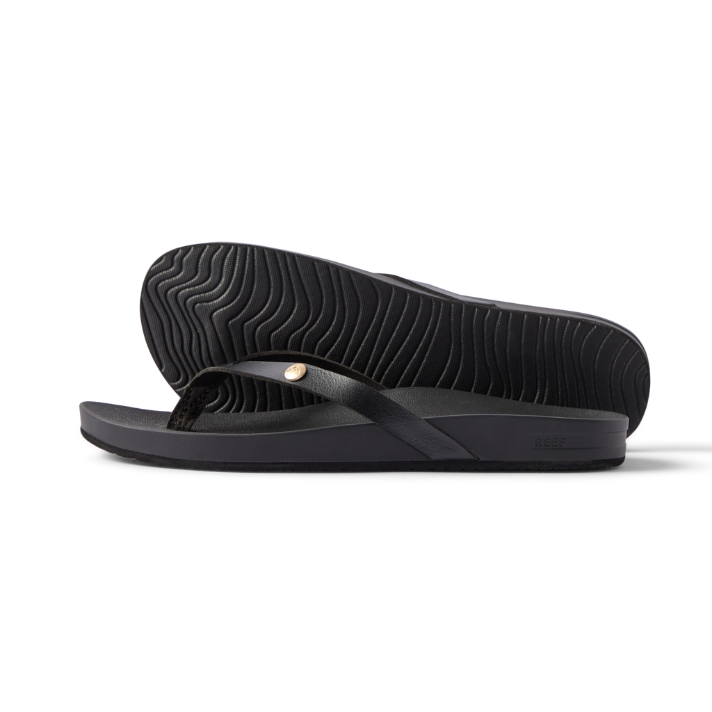 Vista Ivy women's black flip flop side view showing sole with textured pattern and soft cushioning for beach comfort