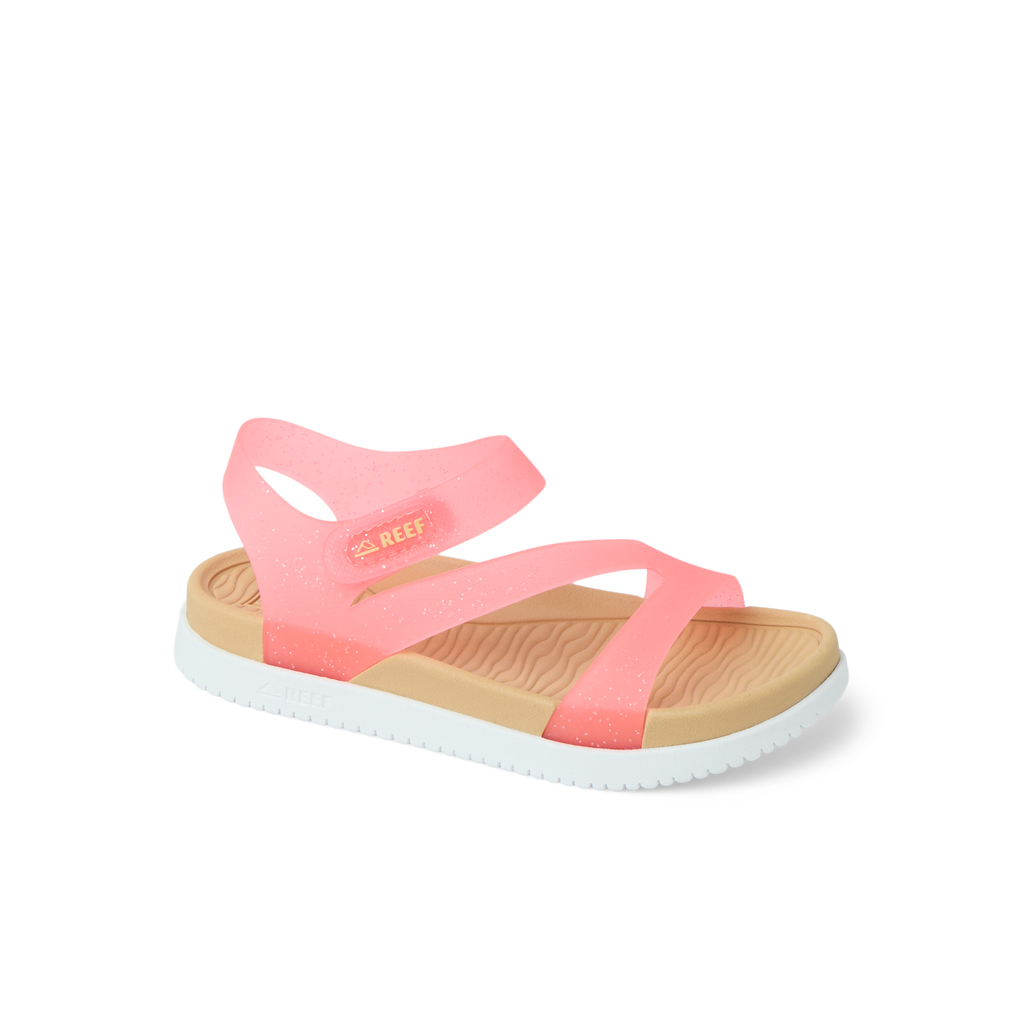 Little Cali Coastin girls' sandal facing right, pink glitter straps, soft cushioned footbed, beach-inspired comfort.