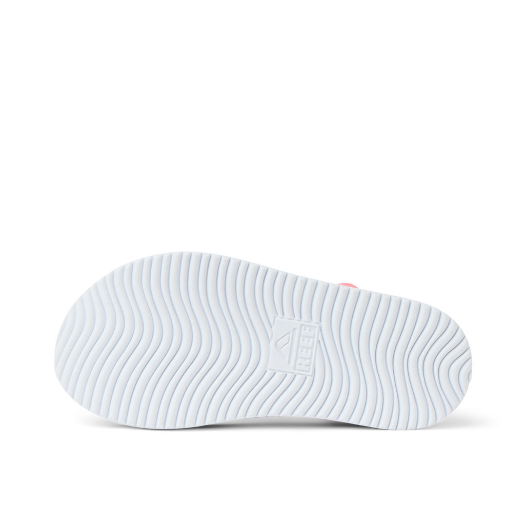 Little Cali Coastin showing the outsole facing up, highlighting textured grip with REEF anatomical arch support for comfort.