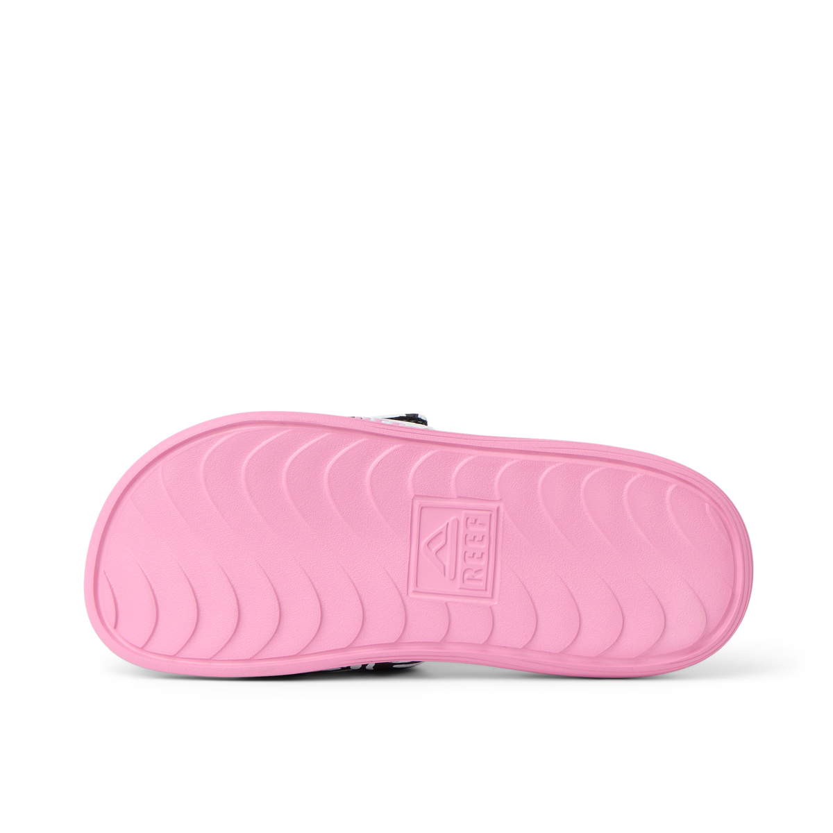 Kids Salty Slide right sandal sole in pink, showing molded footbed with anatomical arch support and durable texture