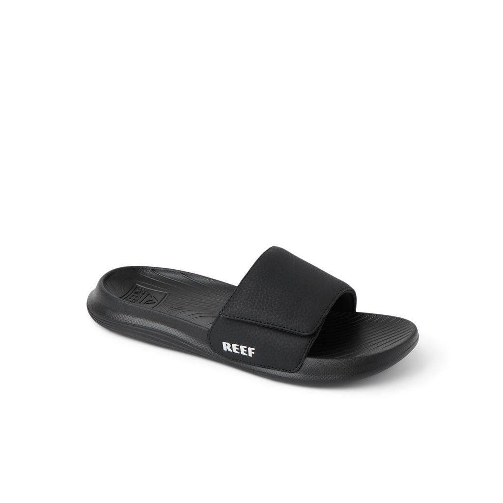 Kids Salty Slide facing right, black and white, beach-inspired slide with anatomical arch support and soft cushioning.