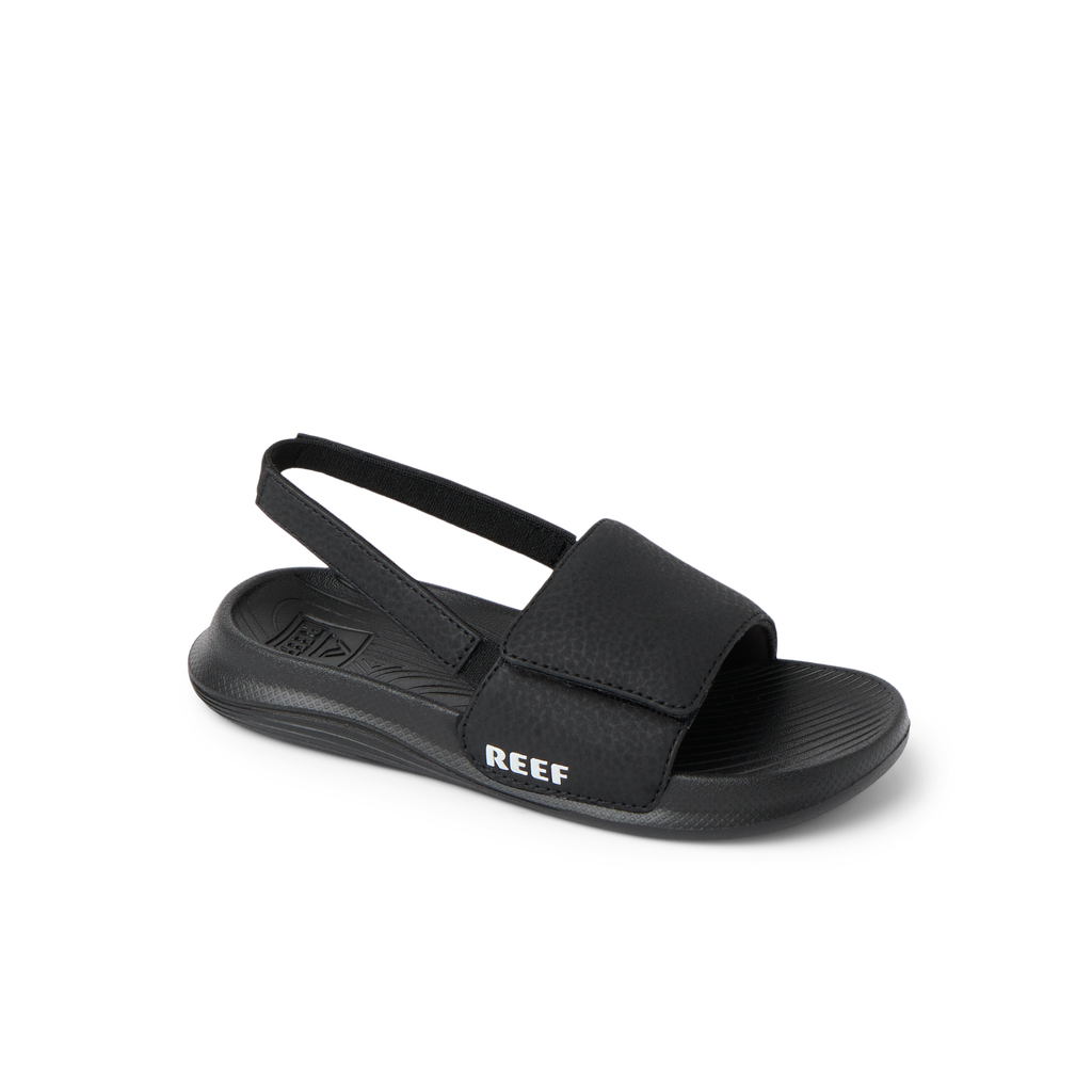 Little Salty Slide boys' sandal facing right, showing top and side, with cushioned arch support and water-friendly materials.