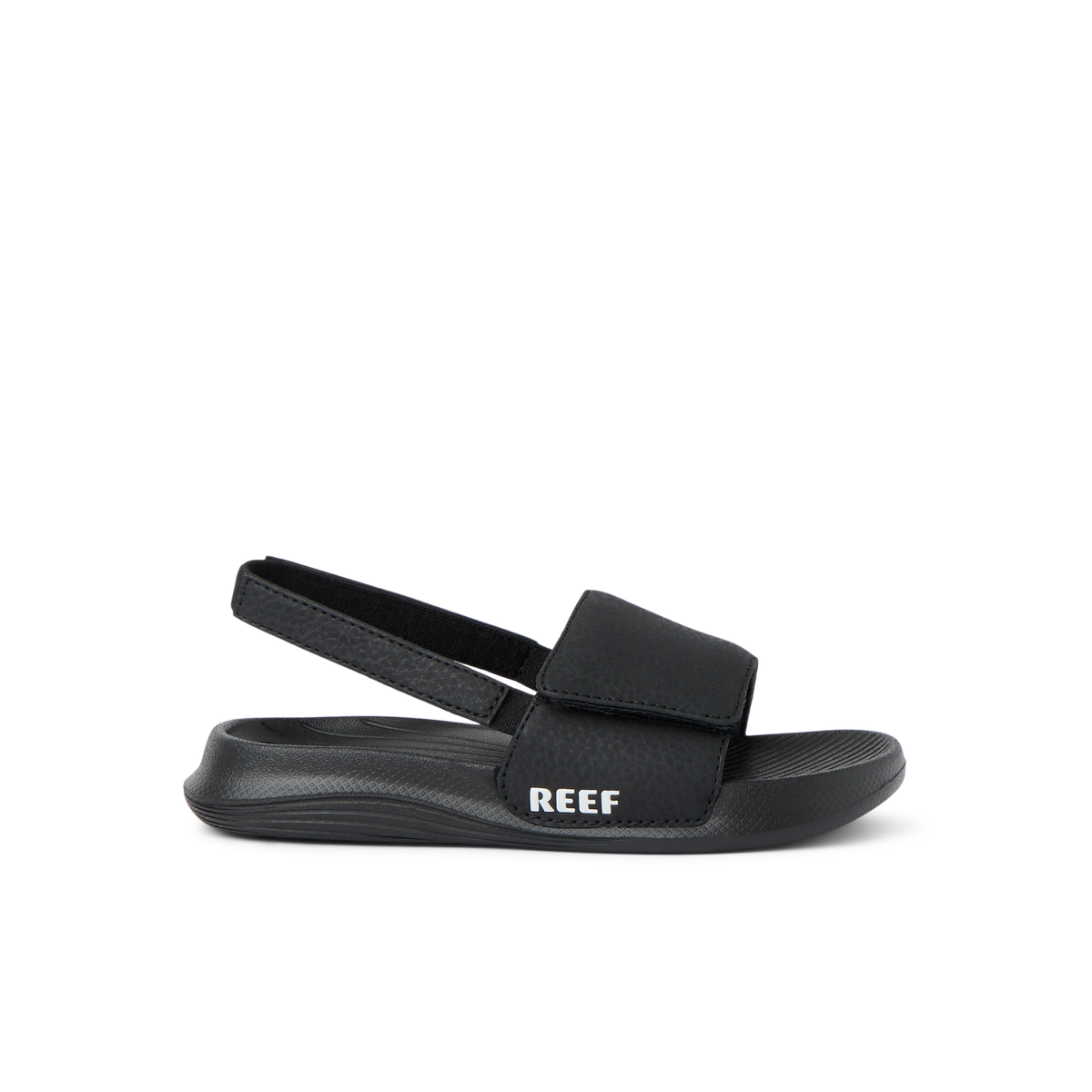 Little Salty Slide for boys facing right, showing side view with soft-rebound cushioning and arch support in black.
