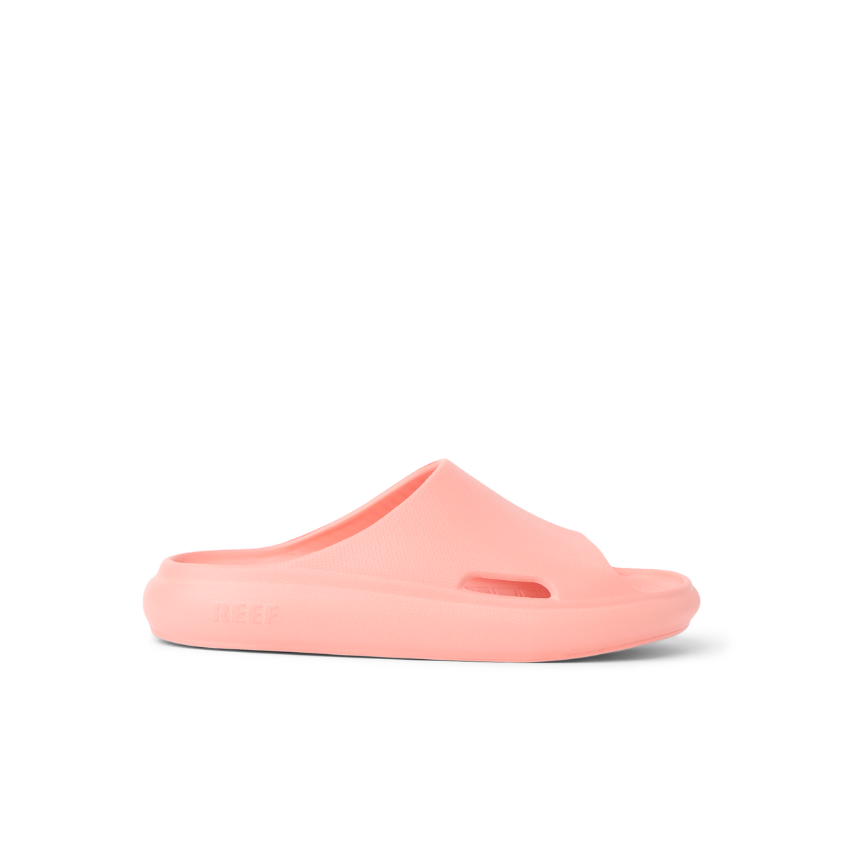 Kids Rio Slide coral-colored unisex slide facing right showing side profile with soft-rebound cushioning and arch support