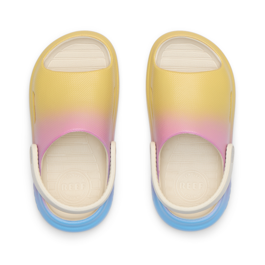 Top view of Little Rio Slide unisex kids sandals in yellow, pink, and blue with cushioned footbeds facing upward.