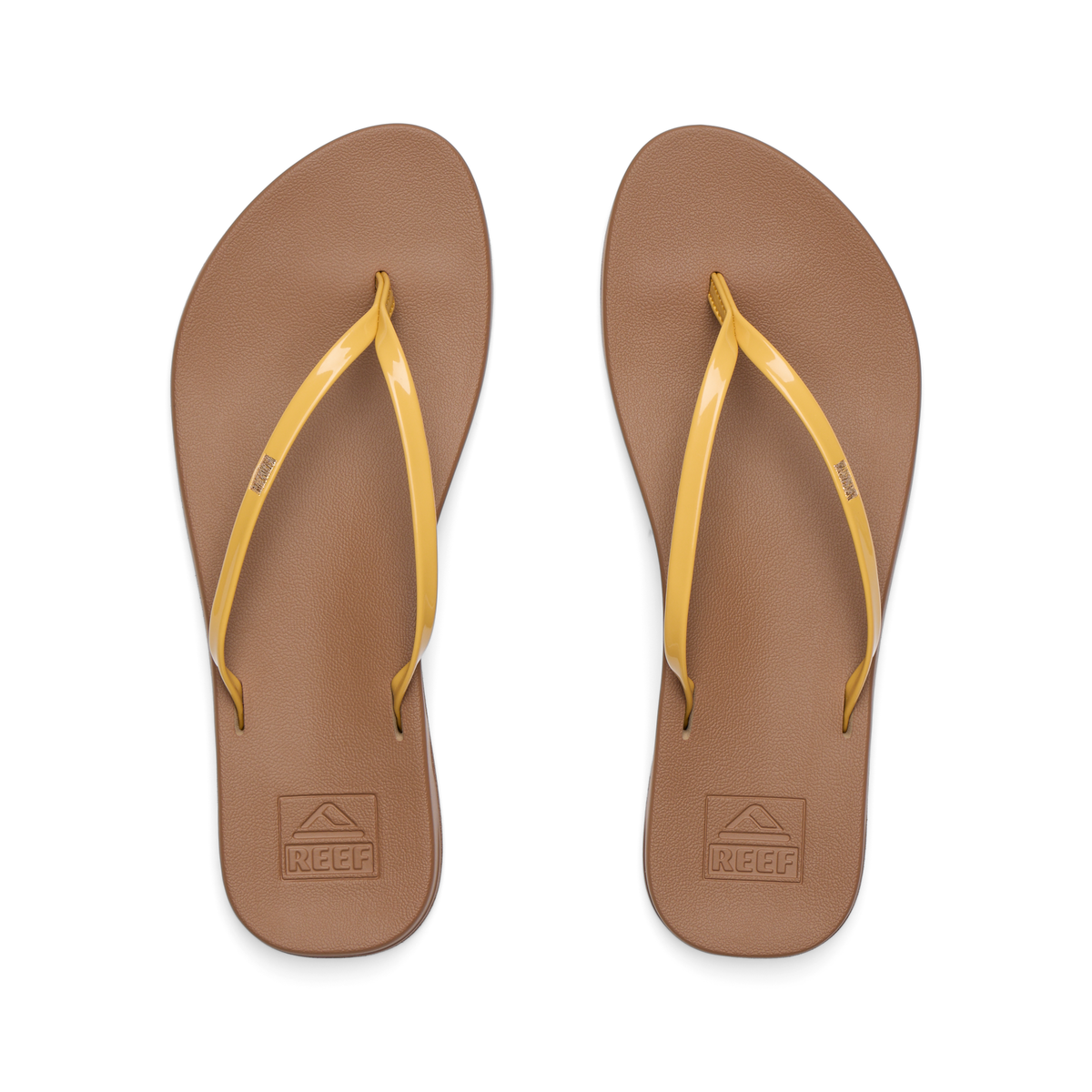 Top view of women's Cushion Slim sandals with golden apricot straps and brown footbeds, designed for beach comfort and support.