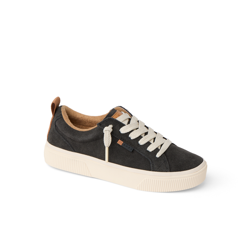 Lay Day Dawn women’s sneaker facing right with charcoal upper, white laces, cushioned sole, and arch support for comfort.