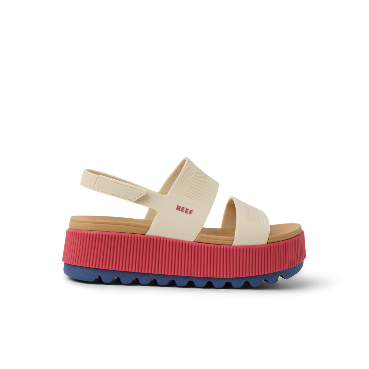 Side view of Water Vista Higher women's sandal with thick red platform sole and beige straps, surf-inspired comfort footwear.