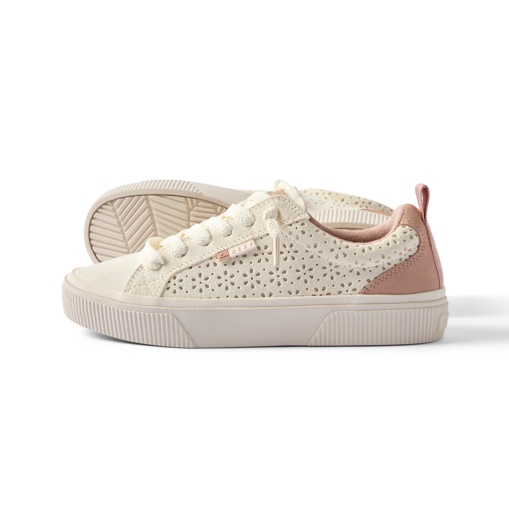 Lay Day Dawn women's shoe facing left, featuring floral cutout design, soft cushioning, and arch support for beach comfort.