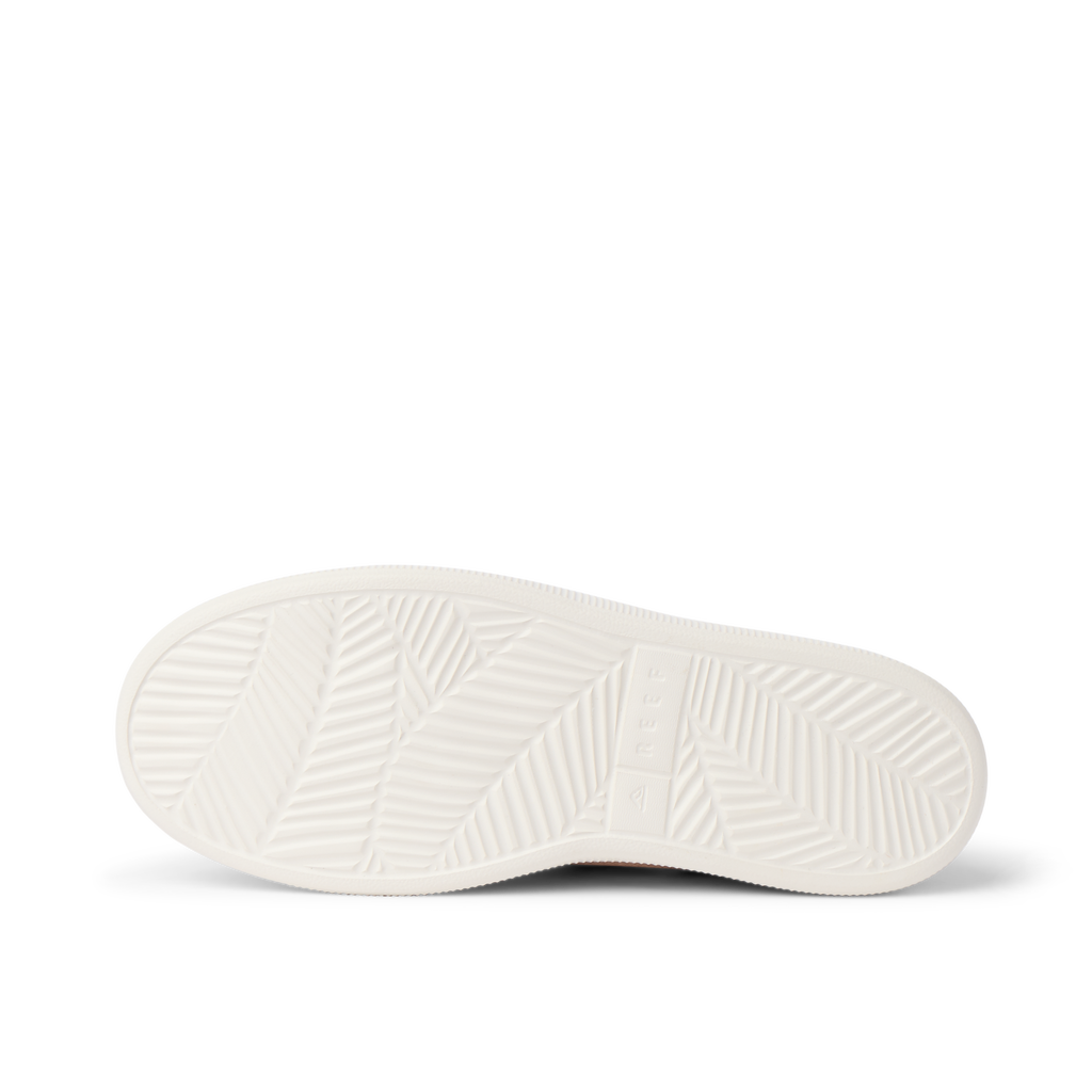 Reef Neptune women's sandal showing close-up of white outsole with textured, water-friendly, durable beach design