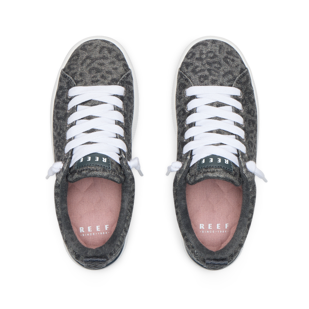 Top view of Neptune Alana women's sneakers with denim cheetah print, cushioned footbeds, and white laces facing forward.