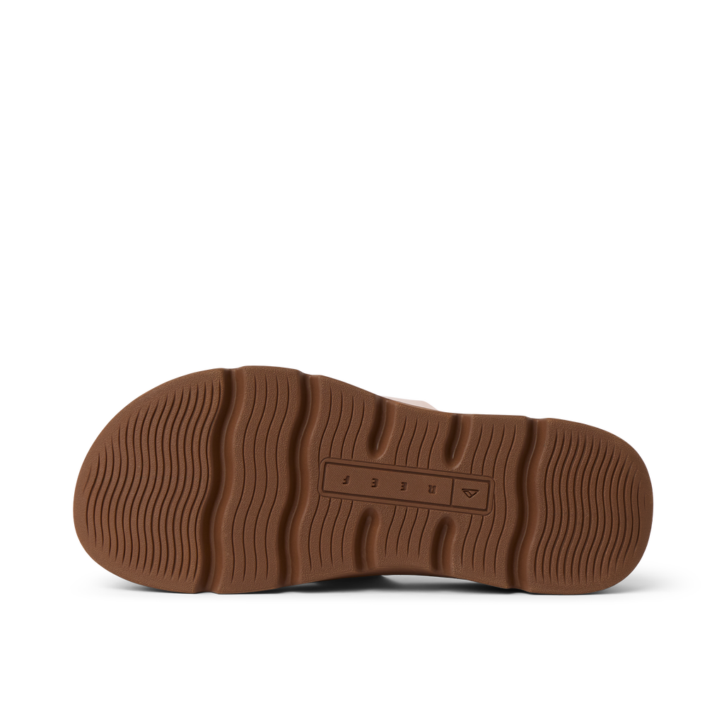 Vista Luxe Thea women's shoe showing the bottom sole facing up with durable, surf-inspired tread design and REEF branding.