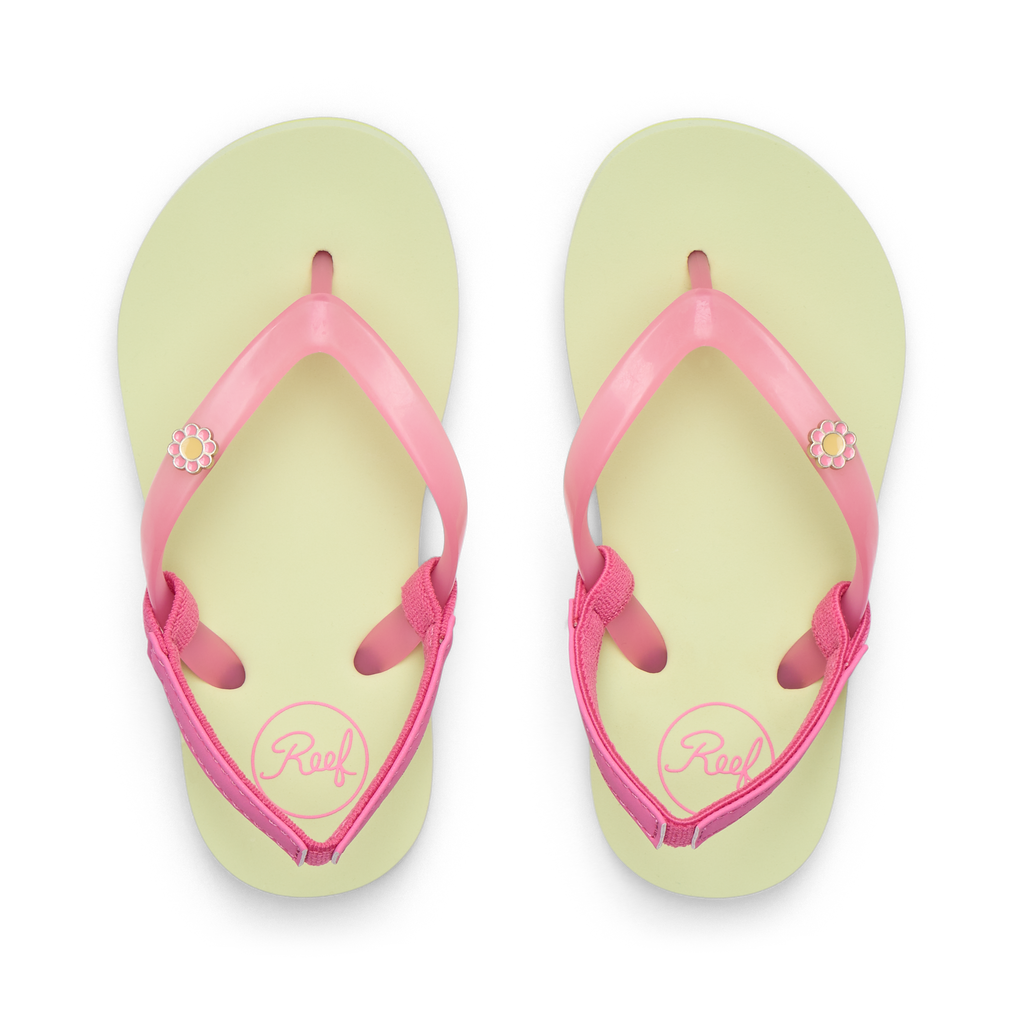 Little Charming girls' flip flops facing up, pink straps with flower detail, lime footbed, comfort focused design.