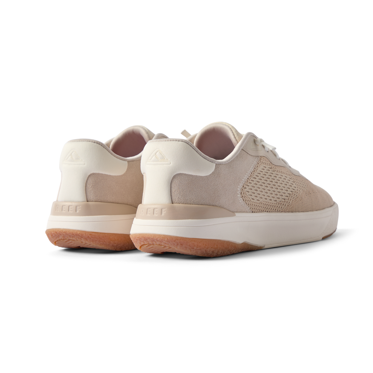 Pair of Shoreline Del Mar men's shoes in light tan facing backward showing heel and side details with cushioning and arch support.