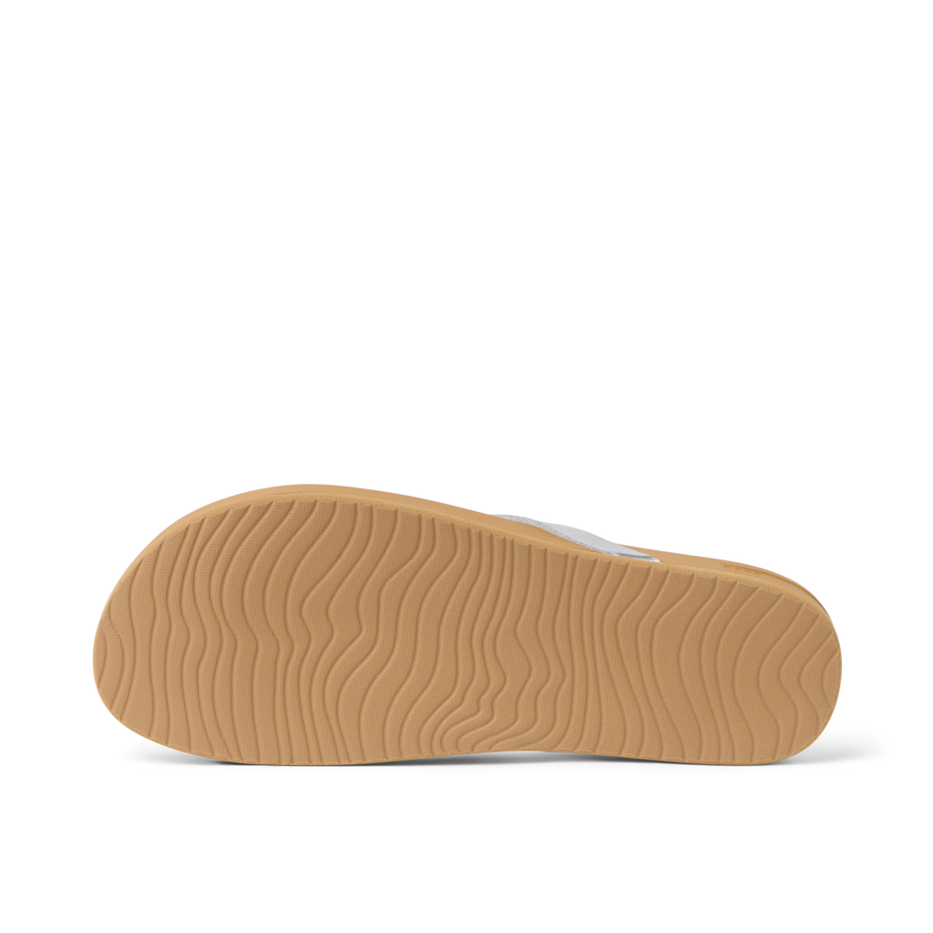 Vista Ivy sandal showing the textured rubber sole facing upward, designed for durable beach comfort and support.