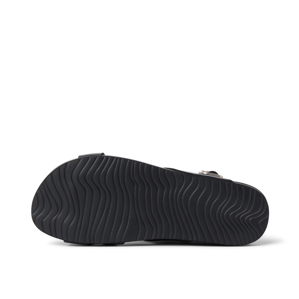 Vista Malia black sandal outsole facing up, showing textured, water-friendly sole with cushioned arch support