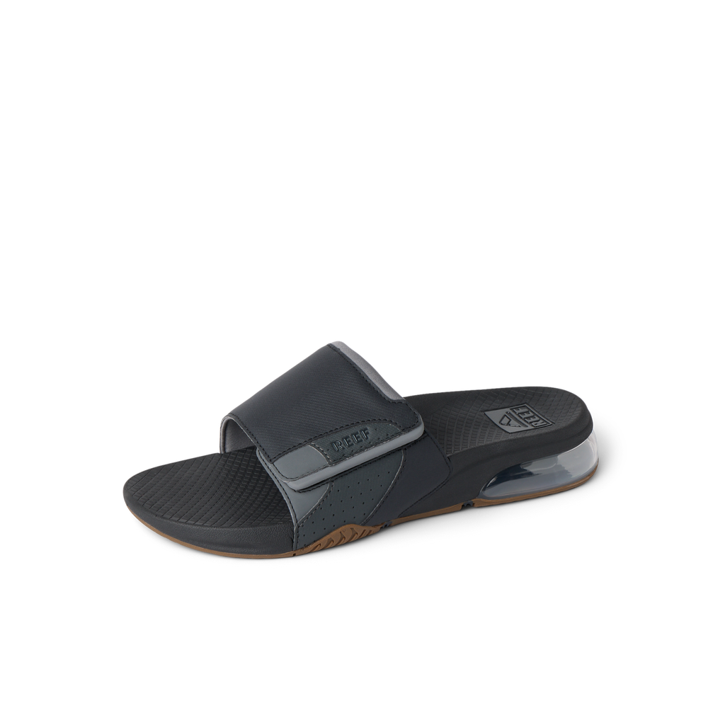 Fanning + Slide facing right, black and grey men's water-friendly sandal with oversized airbag heel and cushioned footbed