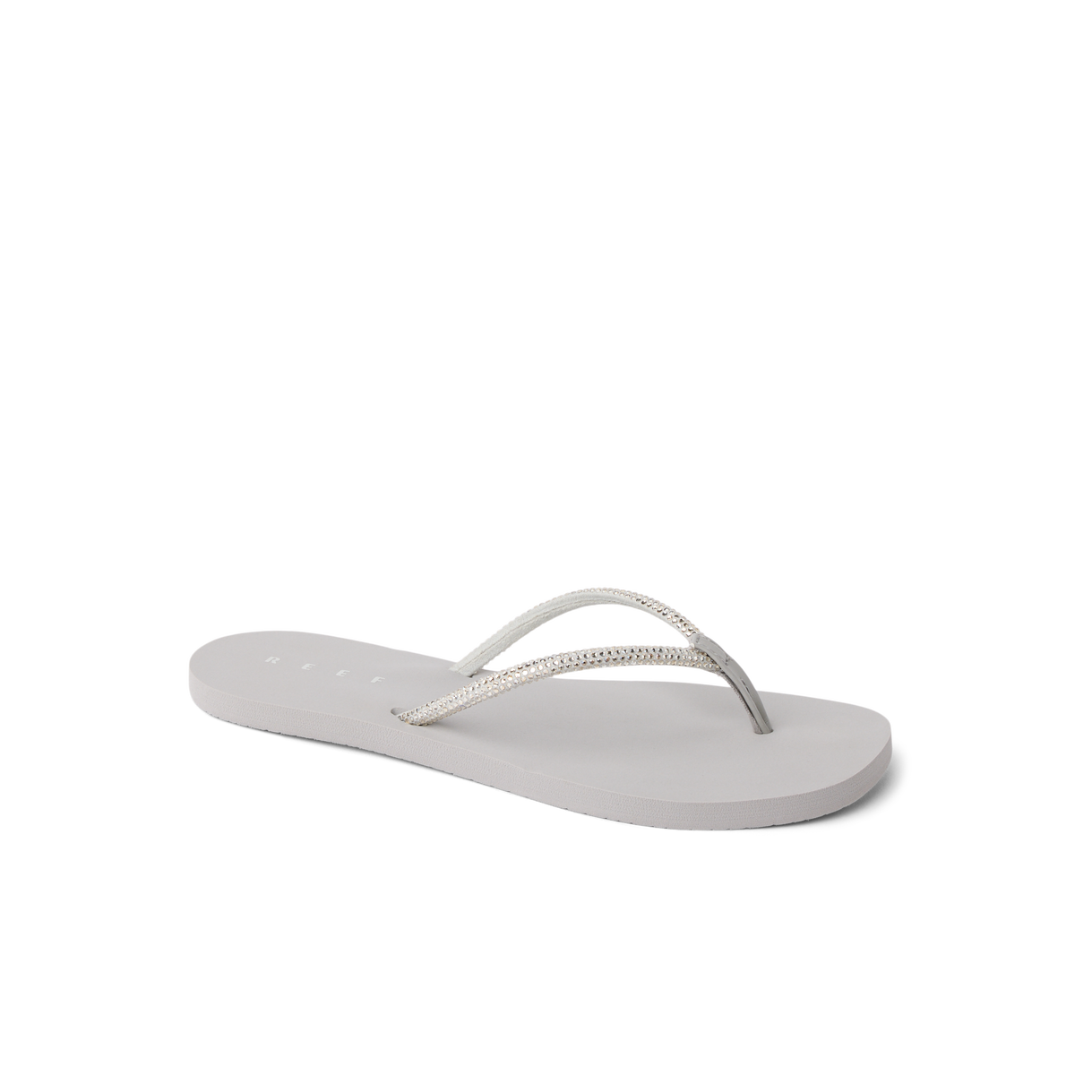 Bliss Bling Fling women's sandal facing left, close-up of cushioned sole and silver straps for beach comfort