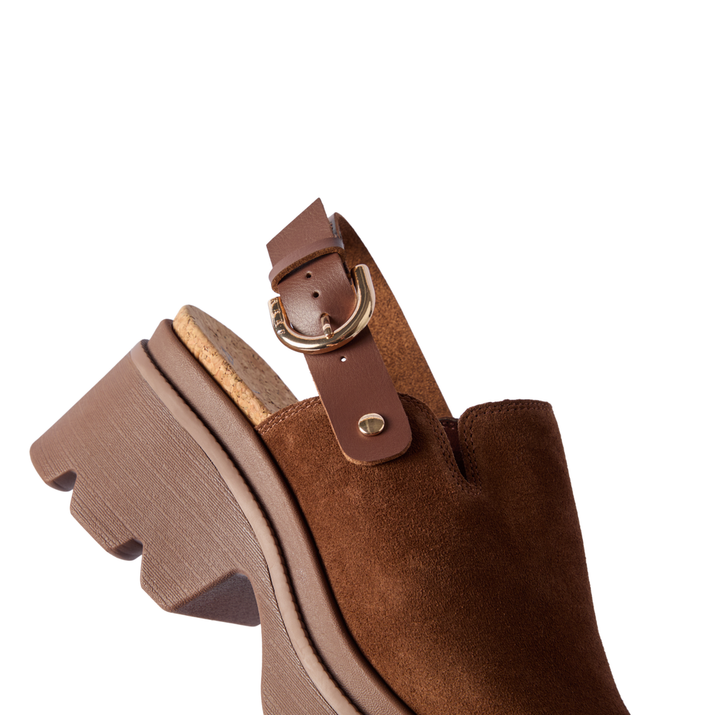 Vista Luxe Solene brown suede clog facing left, close-up of front and adjustable buckle strap with platform sole.