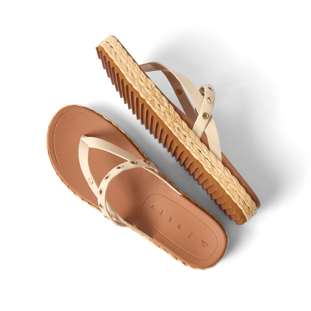 Vista Carmen women's sandals with ivory straps, rivet accents, and textured sole, angled side and top views, beach-inspired comfort.