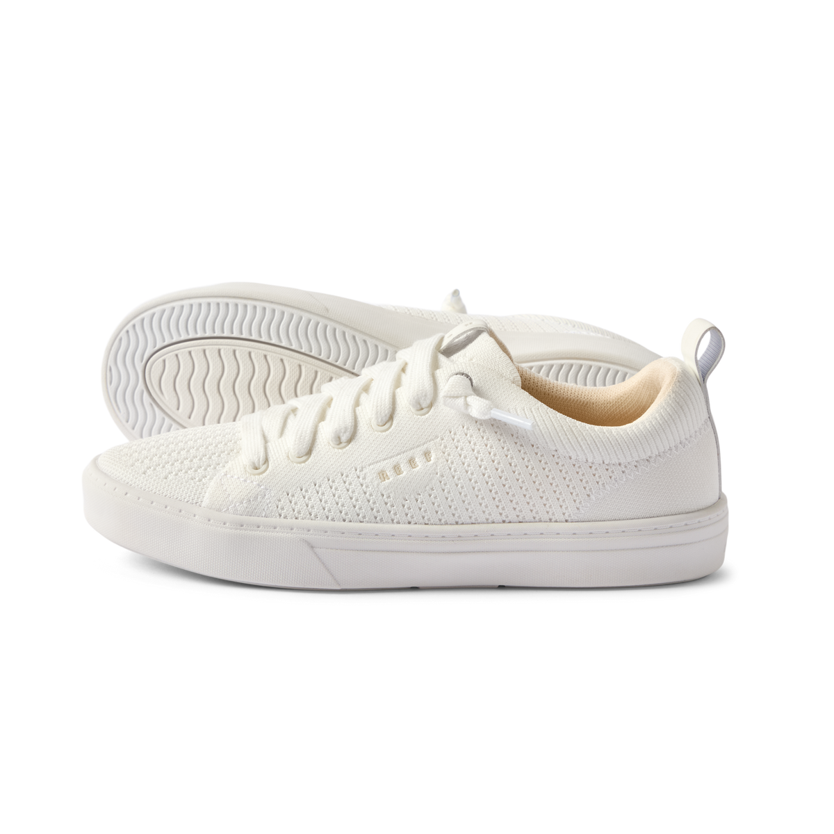 Side view of white Lay Day Lite sneaker facing right, showing lightweight knit upper with anatomical arch support.