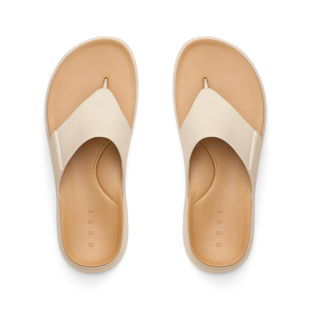 Top view of Cali Laguna white platform sandals facing upward, featuring extra cushioning and arch support, water-friendly design.
