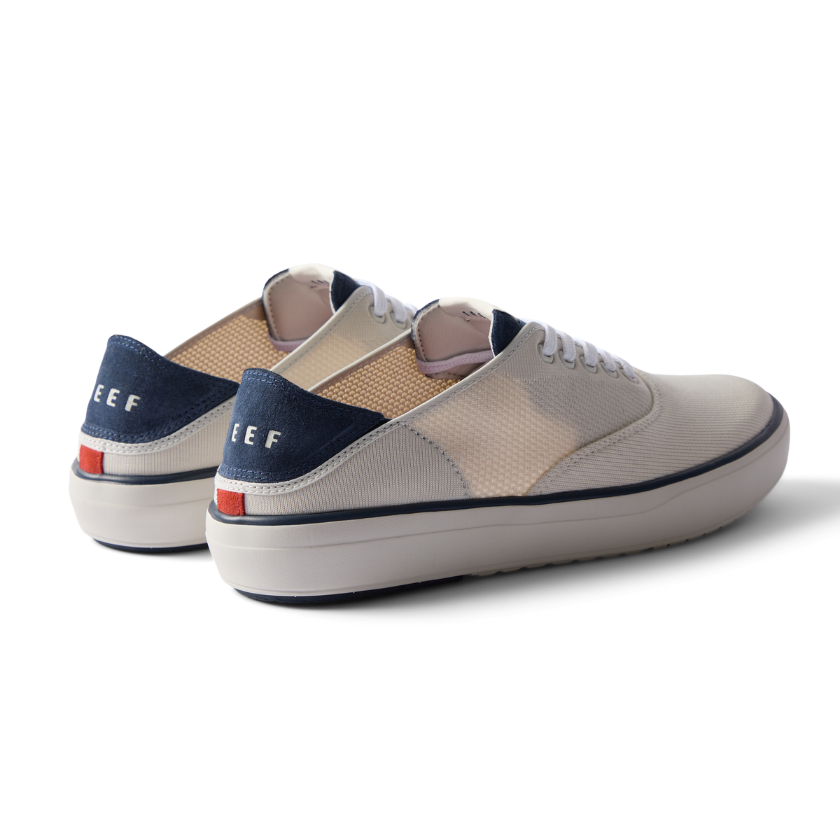 Pair of Neptune Lido men's shoes facing left, showing rear and side views in tan, white, and navy with cushioning.