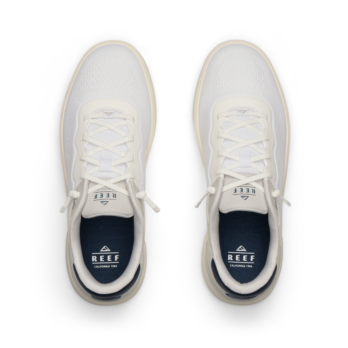 Top view of Shoreline Del Mar men's shoes in white and grey with surf-inspired design, anatomical arch support, and soft cushioning.