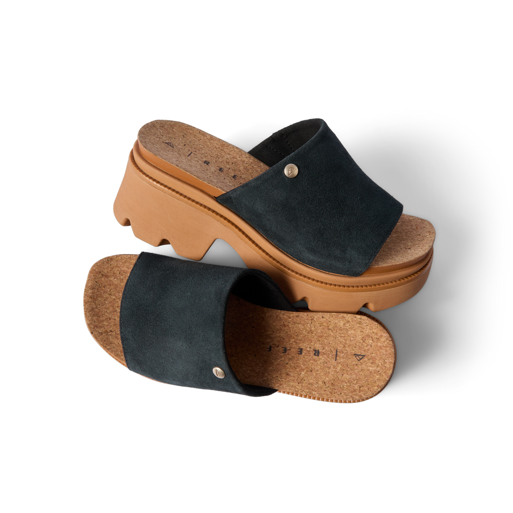 Vista Luxe Evie black suede platform sandals with right shoe facing left, showcasing arch support and cork footbed detail.