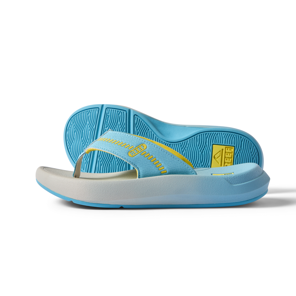 Cruiser men's flip flop sandal facing right with a close-up of the sole, light blue and yellow, surf-inspired comfort