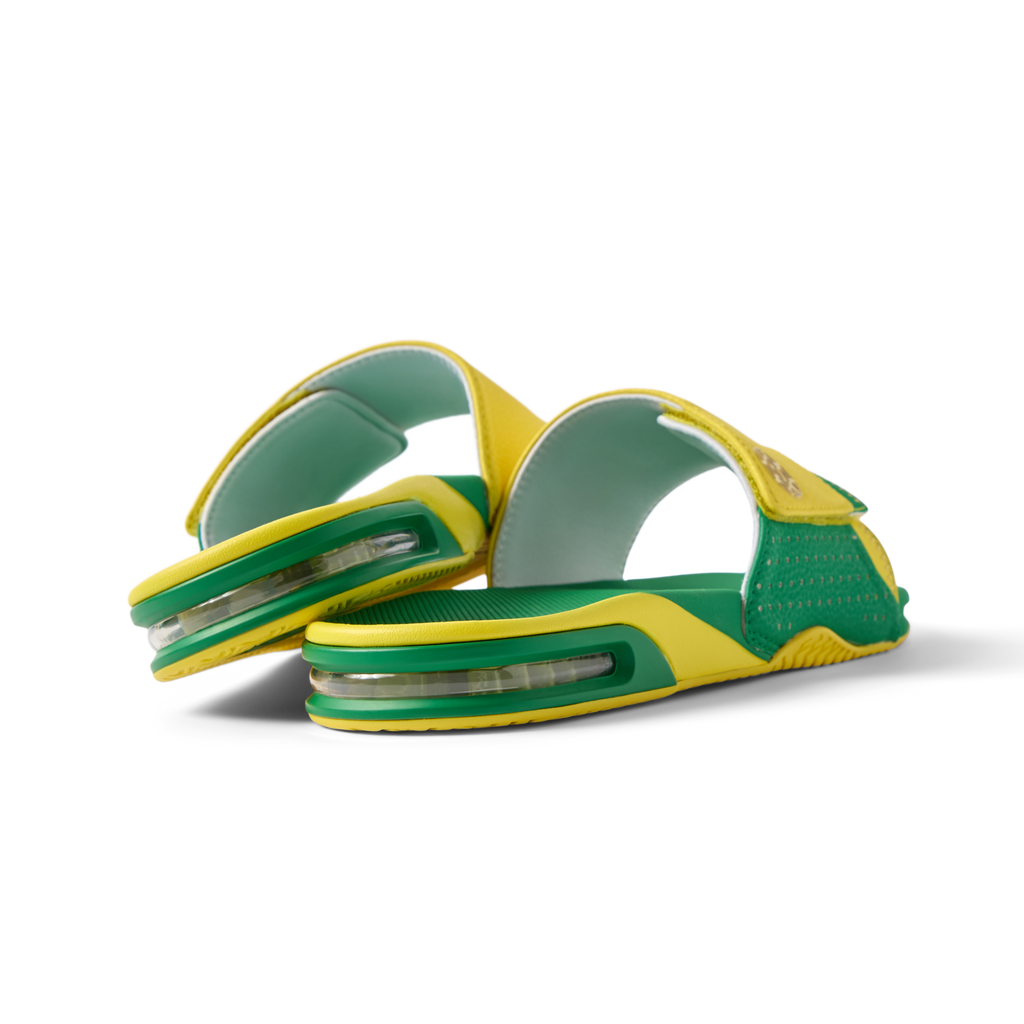 Pair of Fanning Slide sandals facing left, men's green and yellow water-friendly slides with cushioned EVA footbed and airbag heel.