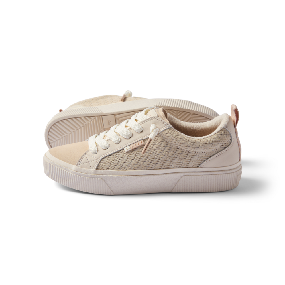 Lay Day Dawn women's sneaker facing right, showing side with woven texture, cushioned sole, and lace-up design.